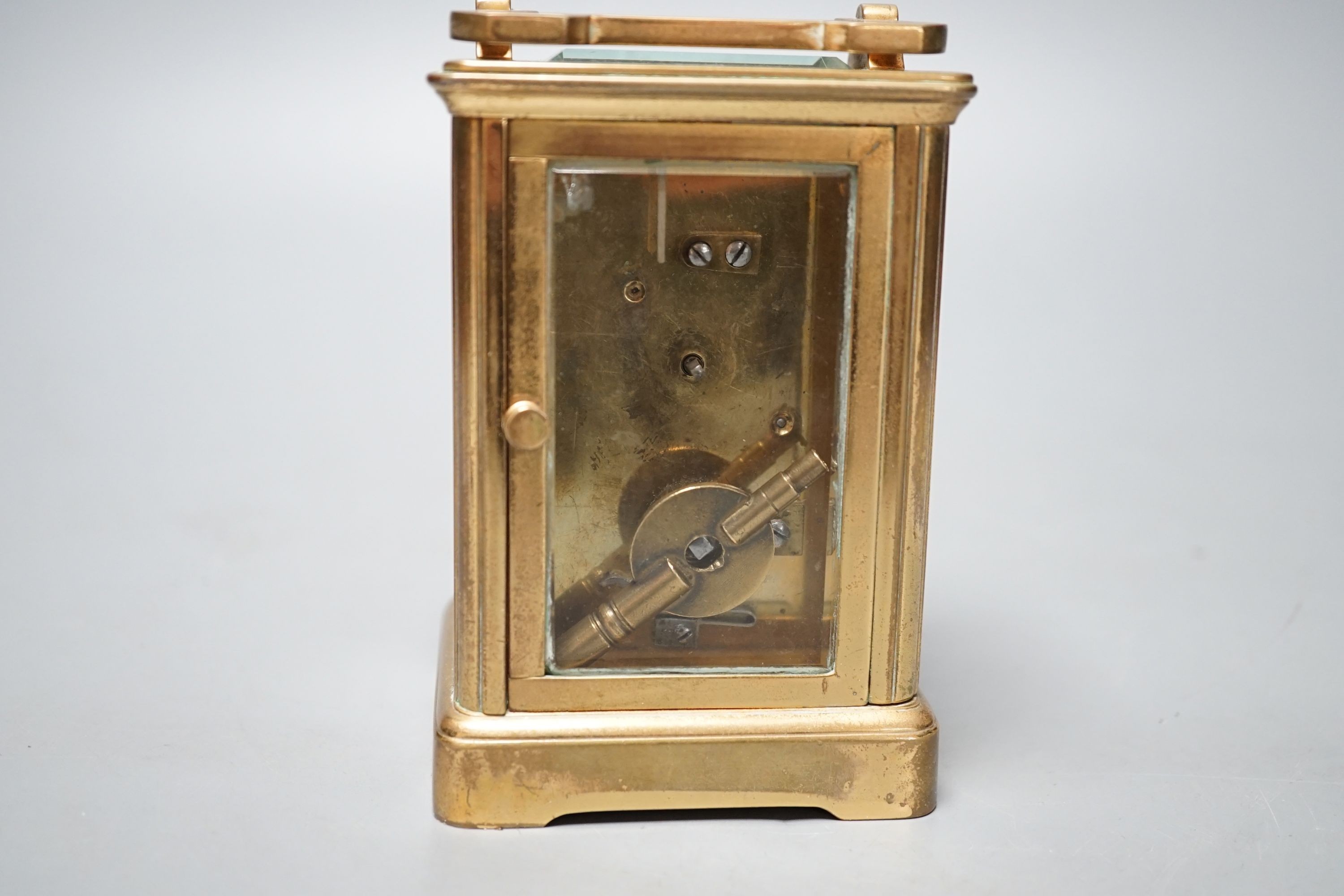 A brass cased French eight day carriage timepiece, 12cm high with key. *This lot is being sold in aid of the charity Prostate Cancer UK with 100% of the hammer price going to the charity”